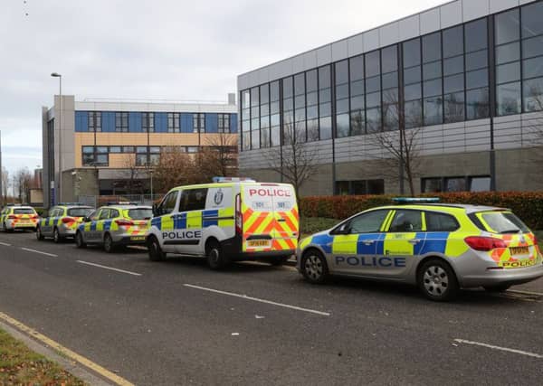 Police vehicles outside Edinburgh College's campus in Granton where a police officer suffered non life-threatening injuries after being stabbed in the back. Picture; PA