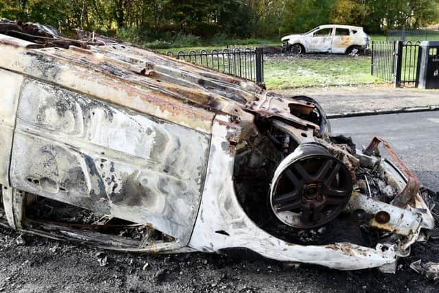 Two wrecked cars lie on the road in the aftermath of a violent Bonfire Night in 

Craigentinny. Picture: LISA FERGUSON