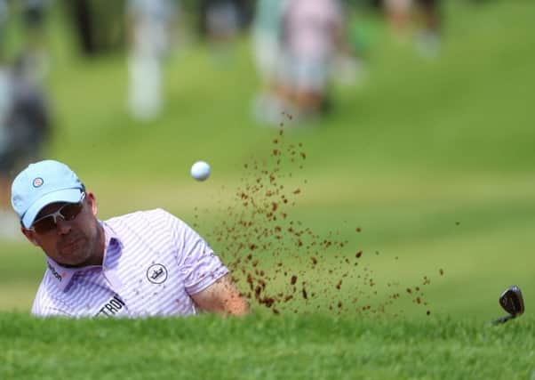 Richie Ramsay hits a bunker shot on the first hole . Pic: Richard Heathcote/Getty Images