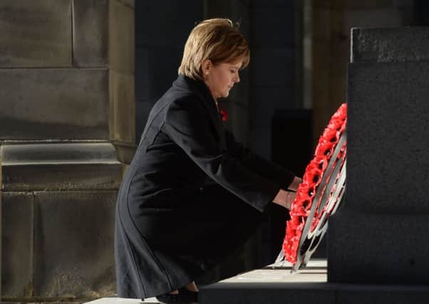 First Minister Nicola Sturgeon lays a wreath at the City Chambers War Memorial.