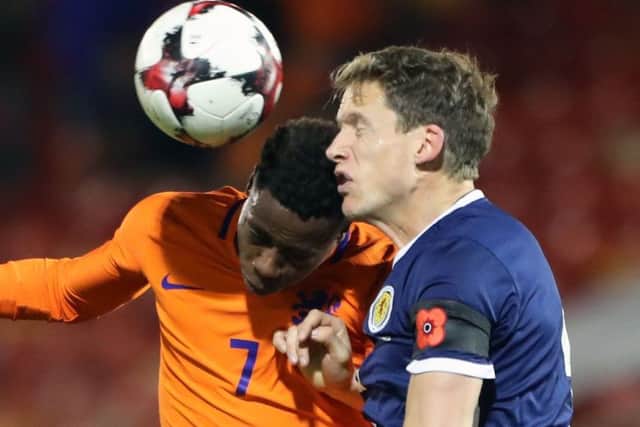 Berra challenges Quincy Promes of the Netherlands