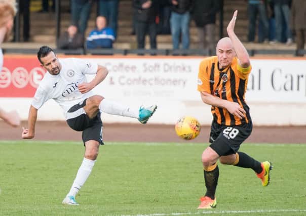 Striker Farid El Alagui tries his luck from range. The former Hibs player was a focal point for City. Pic: Ian Georgeson