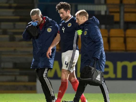 John Souttar is taken off after suffering a head knock playing for Scotland Under-21s against Latvia.