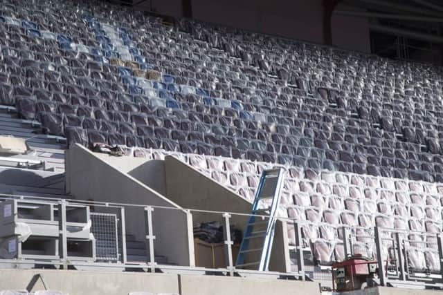 Work is ongoing at Tynecastle to get the new main stand ready for Hearts' match with Partick on Sunday. Pic: SNS