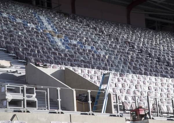 Work is ongoing at Tynecastle to get the new main stand ready for Hearts' match with Partick on Sunday. Pic: SNS