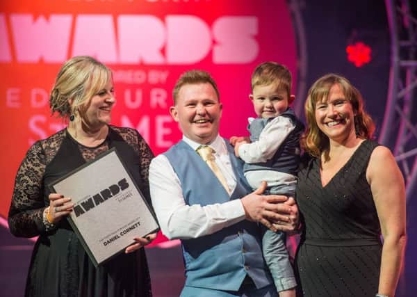 Three-year-old Daniel Cornett, with his parents, is presented with the Cash for Kids Award. Picture: Ian Georgeson