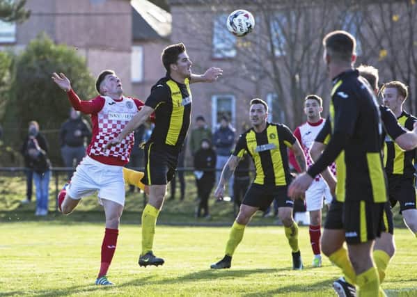 Jack Baird, far left, gets the better of the Lothian Thistle defence to head home St Mirrens third. Pic: SNS