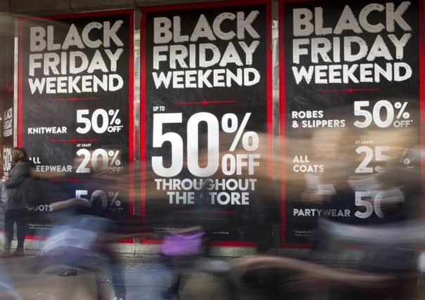 Scots are tipped to spend less than last year in the Black Friday sales. Picture: JUSTIN TALLIS/AFP/Getty Images