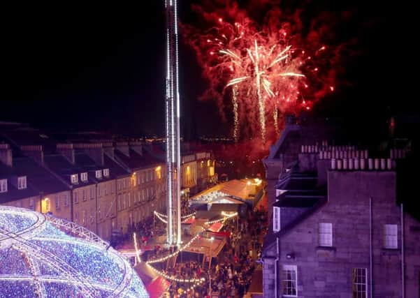 Fireworks in George Street kick off the Capital's Christmas celebrations. Picture: PA