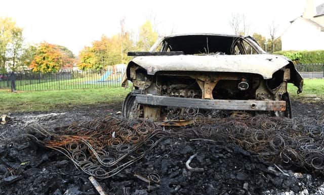 This burned-out car was stolen to November 5, then driven into the bonfire