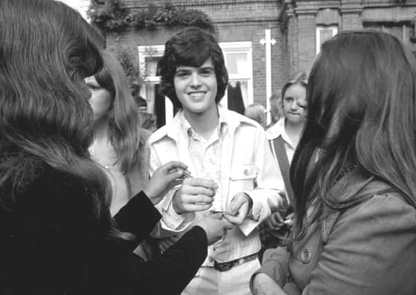 Donny Osmond signs autographs for admiring fans. Picture: Getty
