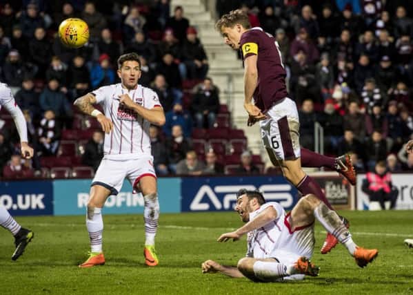 Christophe Berra tries to make the breakthrough for Hearts
