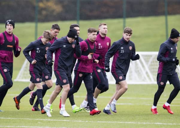 Hearts are put through their paces at the Oriam, with Sam Nicholson (third left) keeping fit with his former club during the MLS close season. Picture: SNS Group