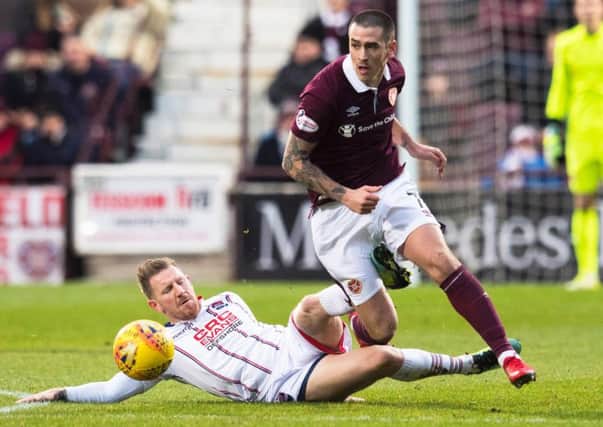 Jamie Walker tried to force an opening for Hearts against stubborn Ross County