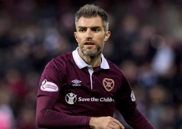 Aaron Hughes went off at half-time against Ross County