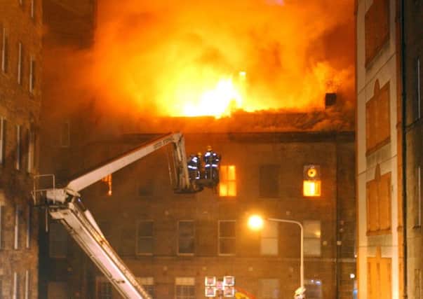 Firemen tackle the blaze in Edinburgh's Old Town. Picture: Tony Marsh