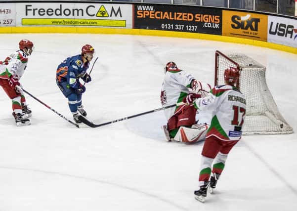 Edinburgh Capitals captain Mike Cazzola opens the scoring at Murrayfield last night. Pic Ian Coyle