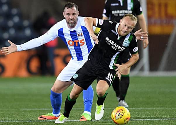 Dylan McGeouch evades the challenge of Kris Boyd during the game against Kilmarnock at Rugby Park