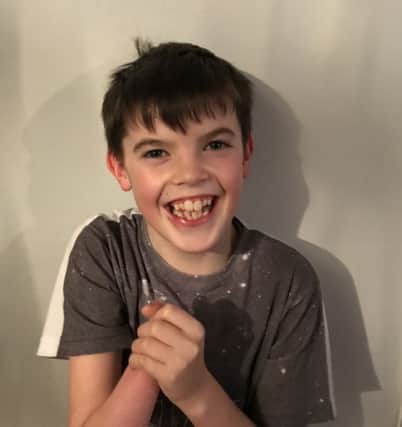 A brave Edinburgh boy has launched an online appeal in the hope that he can achieve his one Christmas wish  to be able to use both his hands.