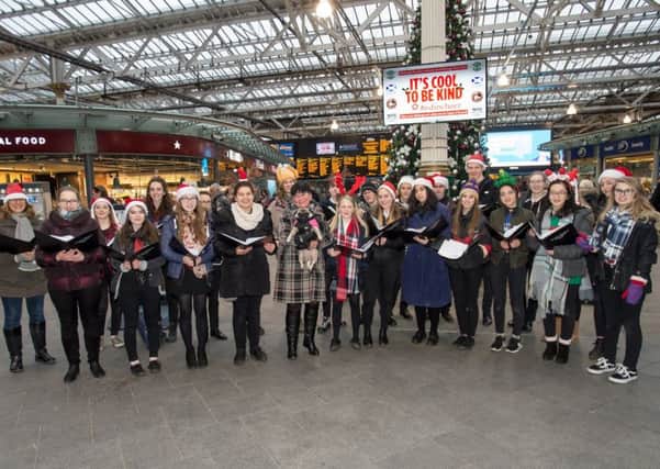 The Edinburgh Cheer choir members at Waverley Station

(c) Wullie Marr Photography