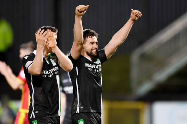 Hibs' Darren McGregor - making his comeback from injury - celebrates at full time. Pic: SNS