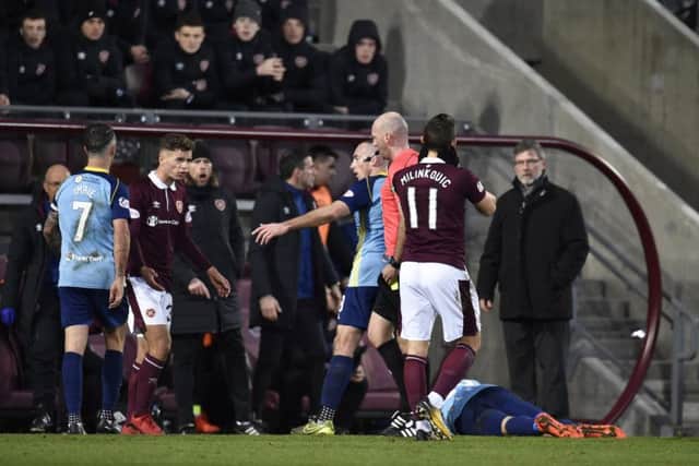 Jamie Brandon's red card gave Hearts "a mountain to climb". Pic: SNS