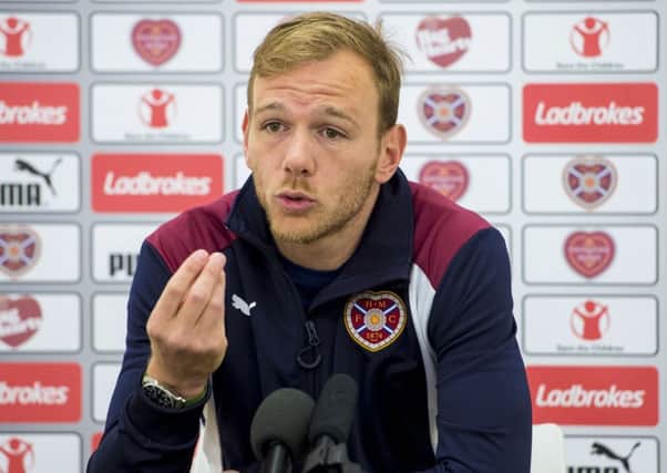 Malaury Martin is eager to get back in the pitch after injury and help Hearts start winning matches once again. Pic: SNS
