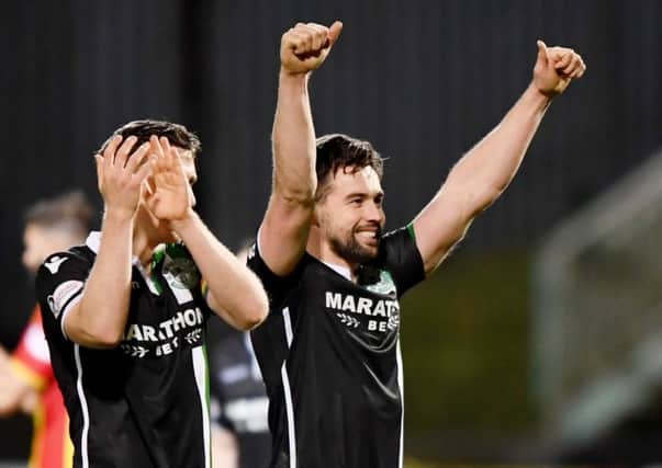 Darren McGregor salutes the travelling Hibs fans at Partick at full time on Saturday