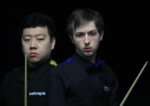 Scott Donaldson, right, was defeated by Li Hang in York. Pic: PA