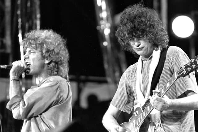 Jimmy Page plays guitar with Led Zeppelin in 1985 (Picture: AP)