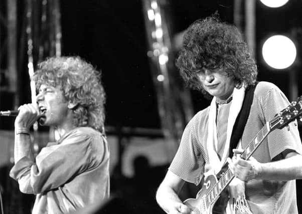 Jimmy Page plays guitar with Led Zeppelin in 1985 (Picture: AP)