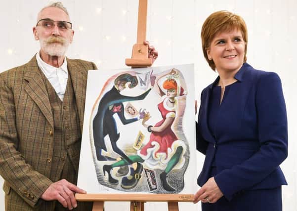 Scottish First Minister Nicola Sturgeon and John Byrne unveil the artwork for her official 2017 Christmas Card at St Margaret's House (Photo by Jeff J Mitchell - WPA Pool /Getty Images)