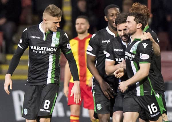 Team-mates, from left, Vykintas Slivka, Marvin Bartley and Darren McGregor, rush to Lewis Stevenson at Firhill last weekend. Pic: SNS