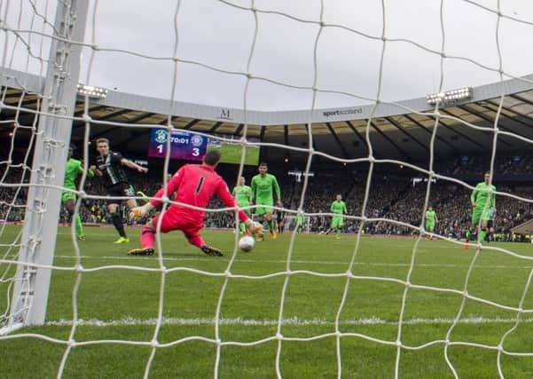 Shaw pounces to fire past Celtic 
goalkeeper Craig Gordon at Hampden in the Betfred Cup semi-final