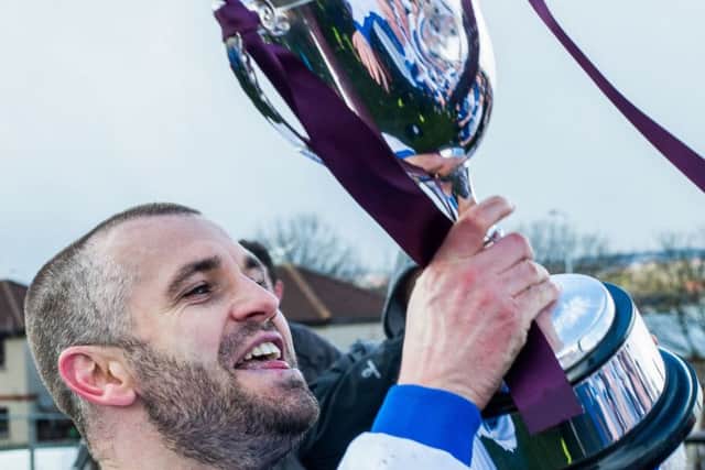 Darren Smith celebrates winning the league title with
Tranent