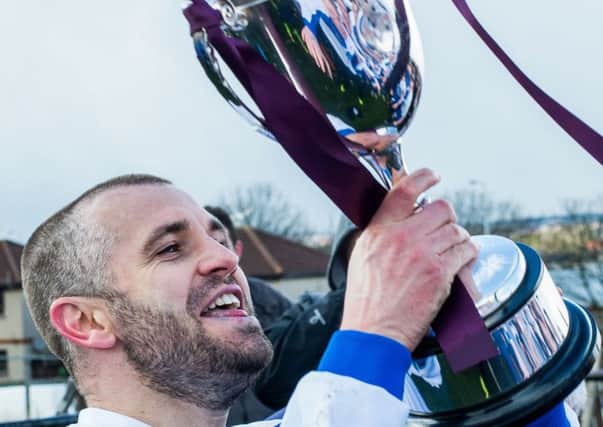 Darren Smith celebrates winning the league title with 
Tranent