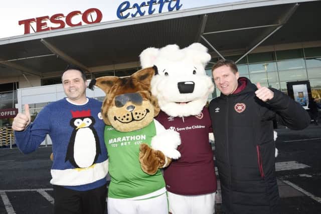 Hearts ex player and manager Gary Locke with store manager Fraser Cromar