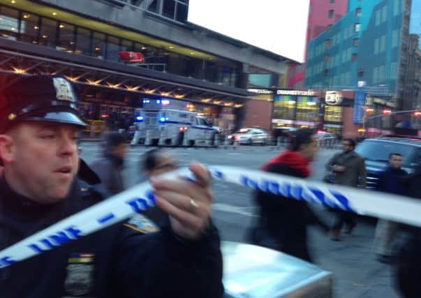 Police respond to a report of an explosion near Times Square. Picture; AP Photo/Charles Zoeller