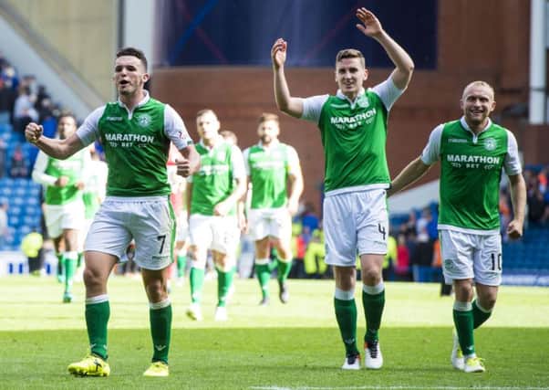 John McGinn, Paul Hanlon and Dylan McGeouch celebrate Hibs' win over Rangers in August. Pic: SNS