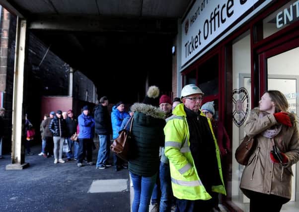 Hearts fans queue at the Tynecastle ticket office. Pic: Lisa Ferguson