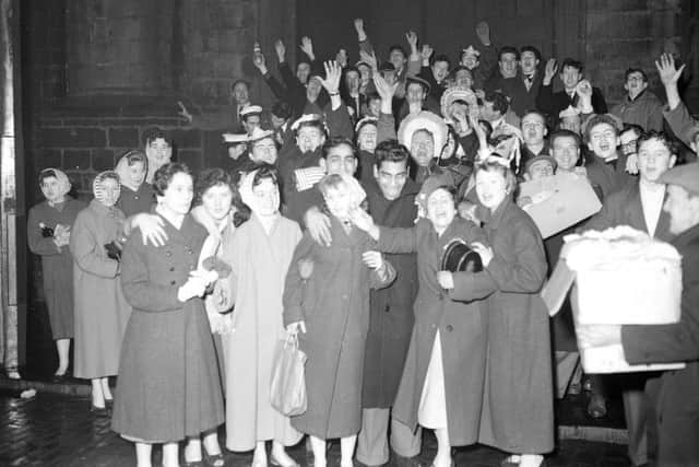 Hogmanay revellers at Tron Kirk Edinburgh 1959. Picture: TSPL