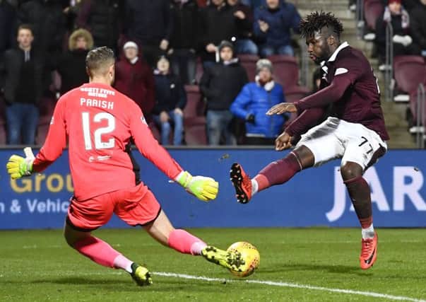 Esmael Goncalves fires beyond Dundee keeper Elliot Parish to put Hearts ahead. Pic: SNS