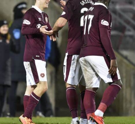 Hearts' teenage debutant Anthony McDonald, left, is congratulated on his assist by Rafal Grzelak. Pic: SNS