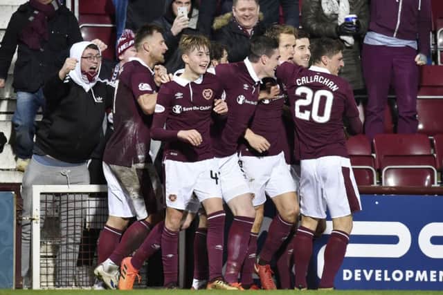 Hearts players celebrate Berra's goal. Pic: SNS