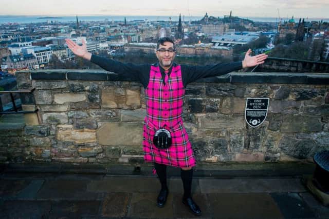 Sanjeev Kohli unveils the new tartan for Edinburgh's Hogmanay. Picture: Ian Georgeson