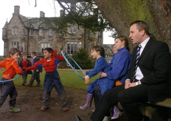 Rod Grant with his pupils in the grounds of Clifton Hall School. Picture: Jon Savage