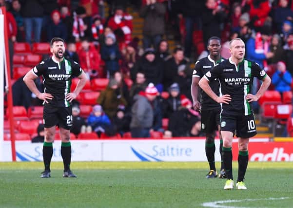 Dylan McGeouch, right, and Hibs endured a difficult day at Pittodrie