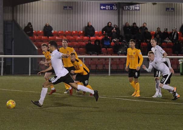 Farid El Alagui slipped as he took the penalty in the second half. Pics: Jon Savage