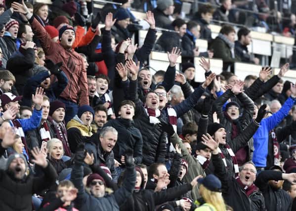 Jubilant Hearts fans celebrate the win over Celtic. Pic: SNS
