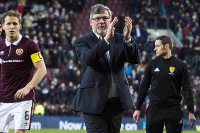 Manager Craig Levein applauds the Hearts faithful. Pic: SNS